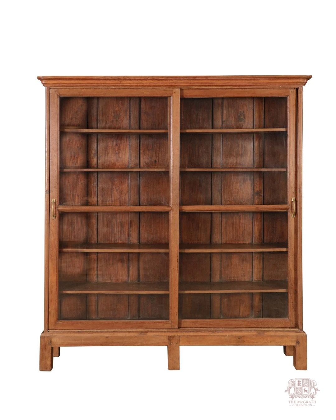 Antique teak library display cabinet with architectural cornice detailing and deep shelving—crafted in the early to mid-1800s.