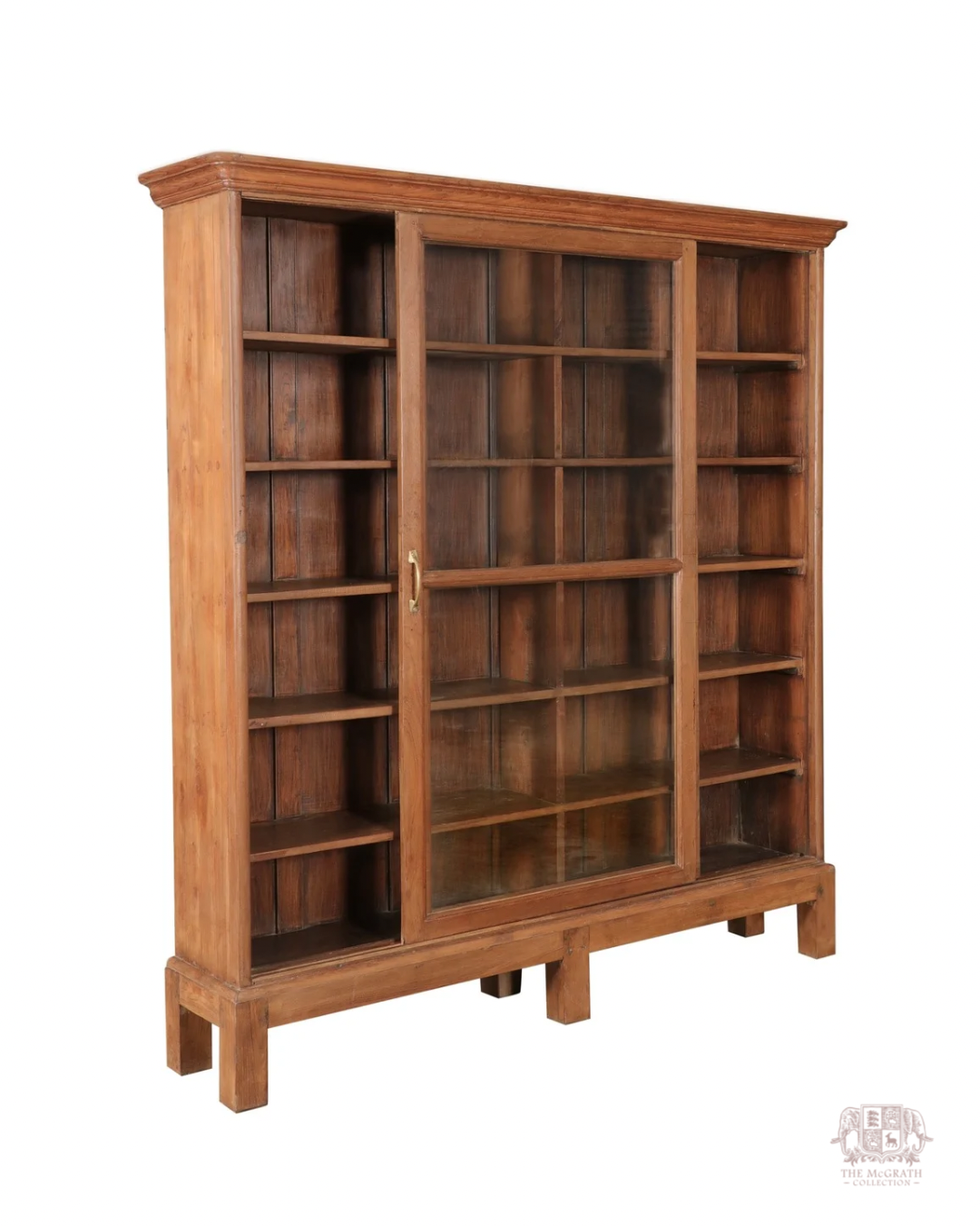 Antique teak library display cabinet with architectural cornice detailing and deep shelving—crafted in the early to mid-1800s