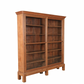 Antique teak library display cabinet with architectural cornice detailing and deep shelving—crafted in the early to mid-1800s.