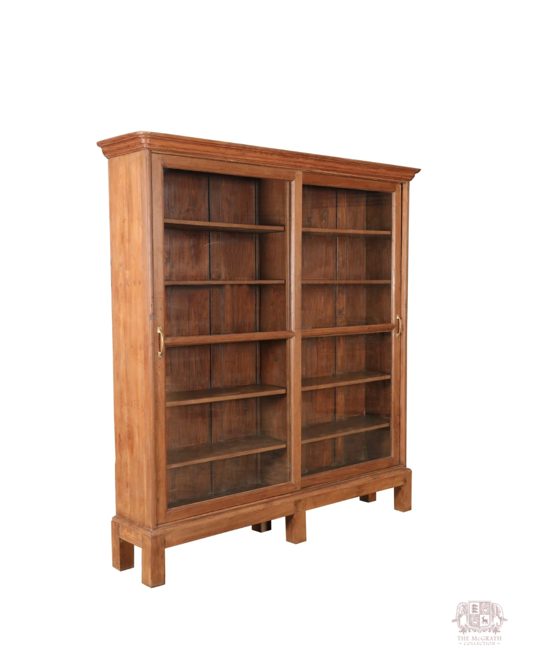 Antique teak library display cabinet with architectural cornice detailing and deep shelving—crafted in the early to mid-1800s.